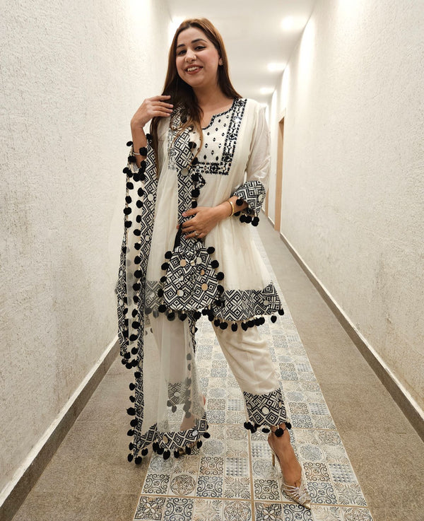 Model wearing Pure Soft Chanderi Silk Shirt Set with mirrorwork and pom-pom lace detailing